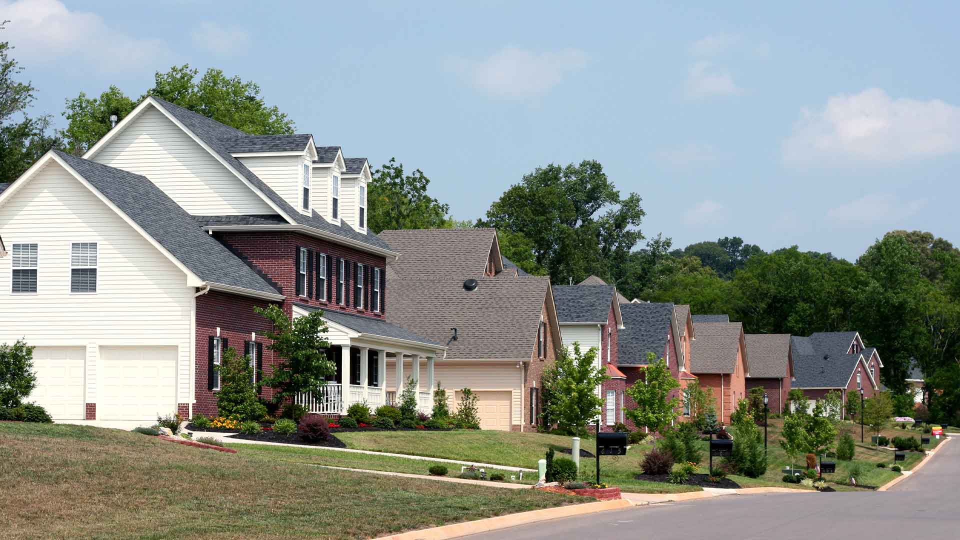 Row of two-story single-family homes in an American suburb