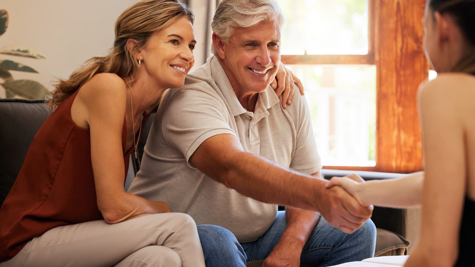 Senior couple meeting with a real estate agent to discuss reverse mortgage options