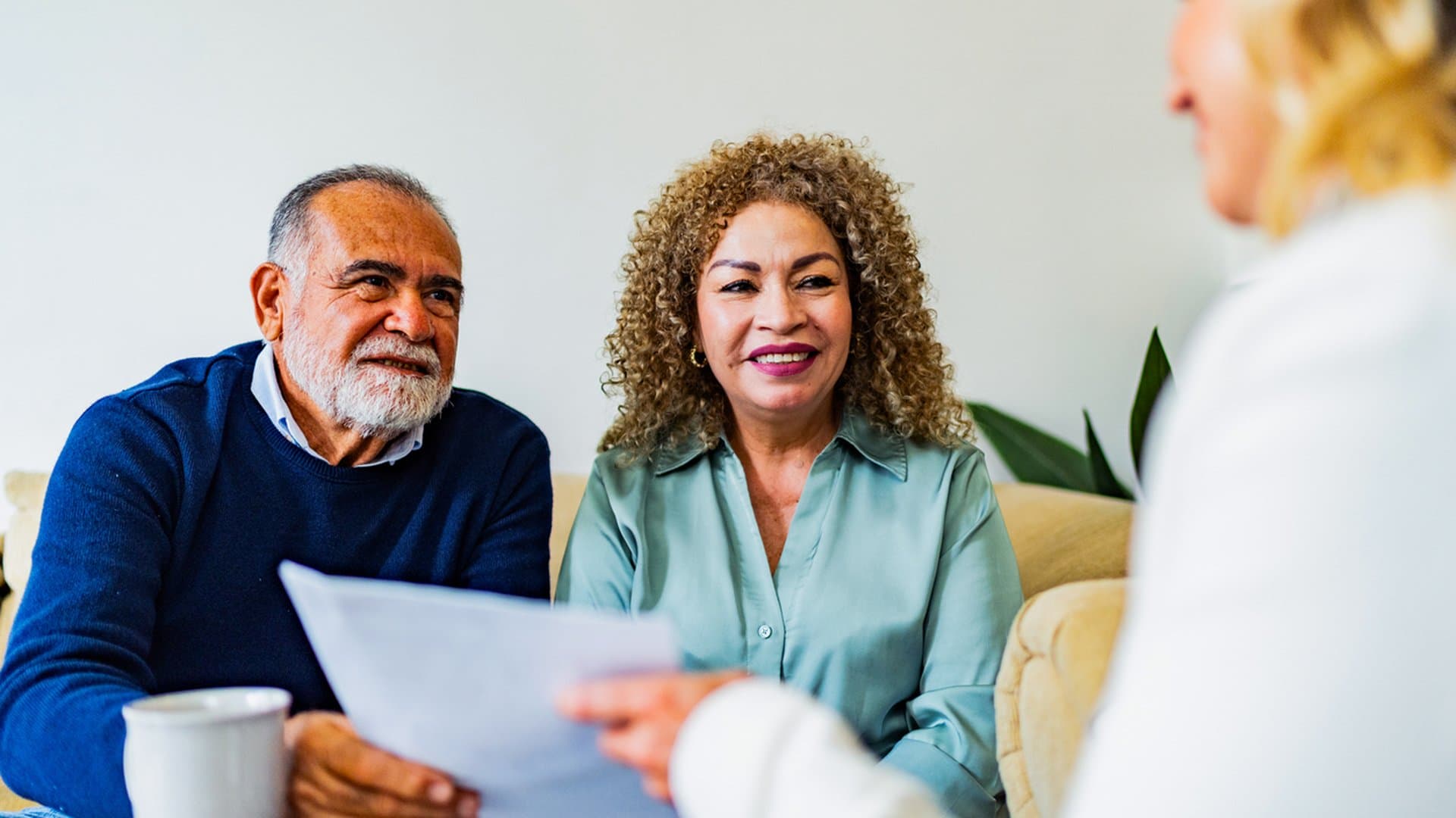 Senior couple meeting with a financial advisor to discuss getting a mortgage in retirement